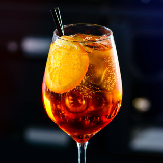 Classic Italian Aperol Spritz Cocktail Close-up On A Bar In Nigh